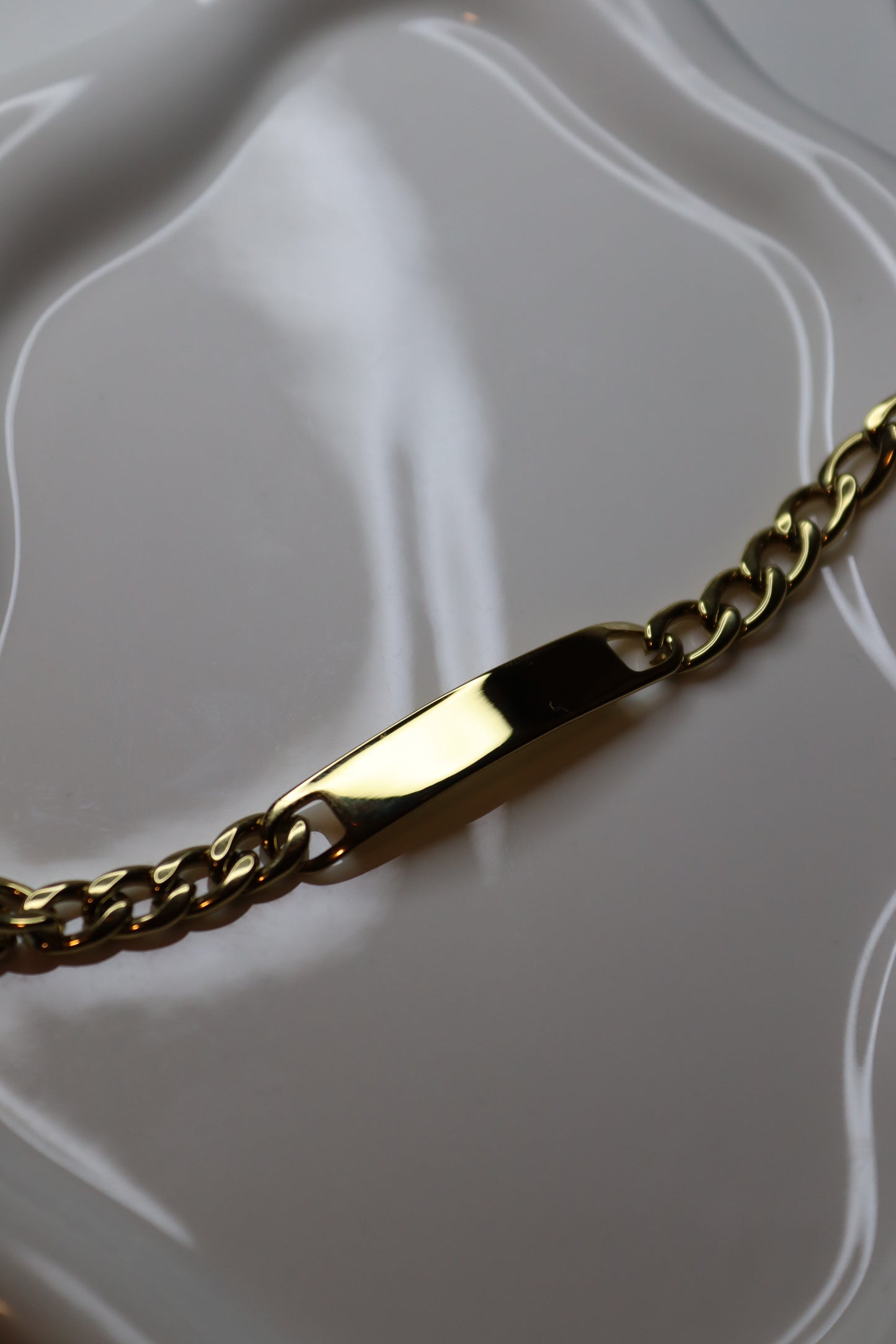 Engraved bracelet with golden bar