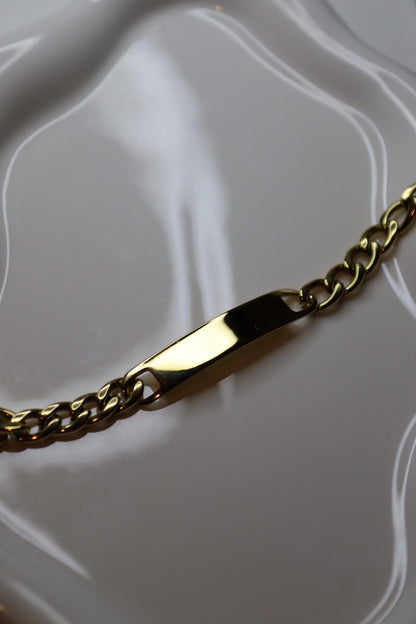 Engraved bracelet with golden bar