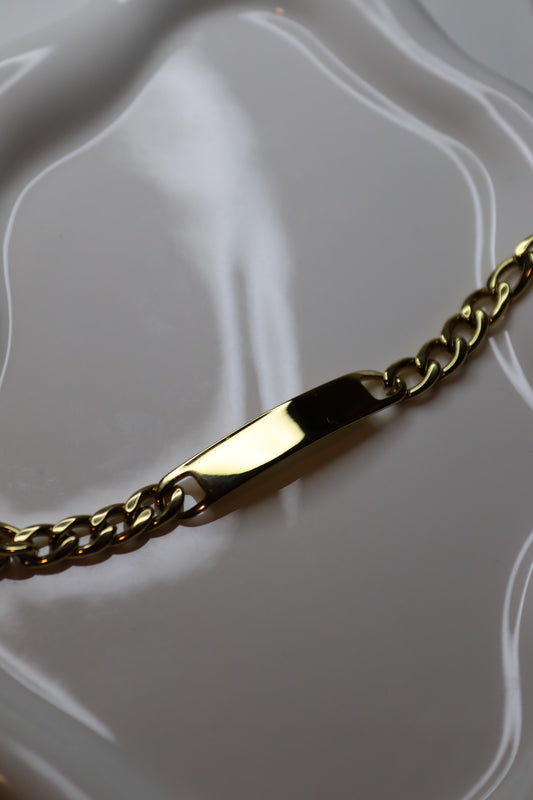 Engraved bracelet with golden bar