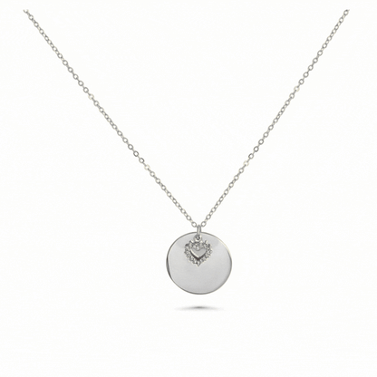 Engraved necklace with round charm and rhinestone heart
