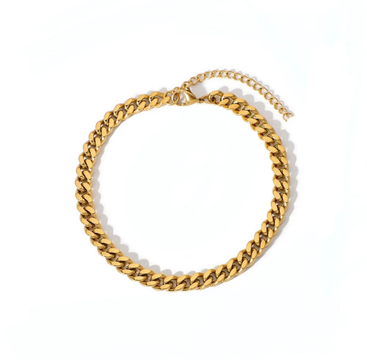 A gold chain bracelet displayed elegantly on a clean white background.