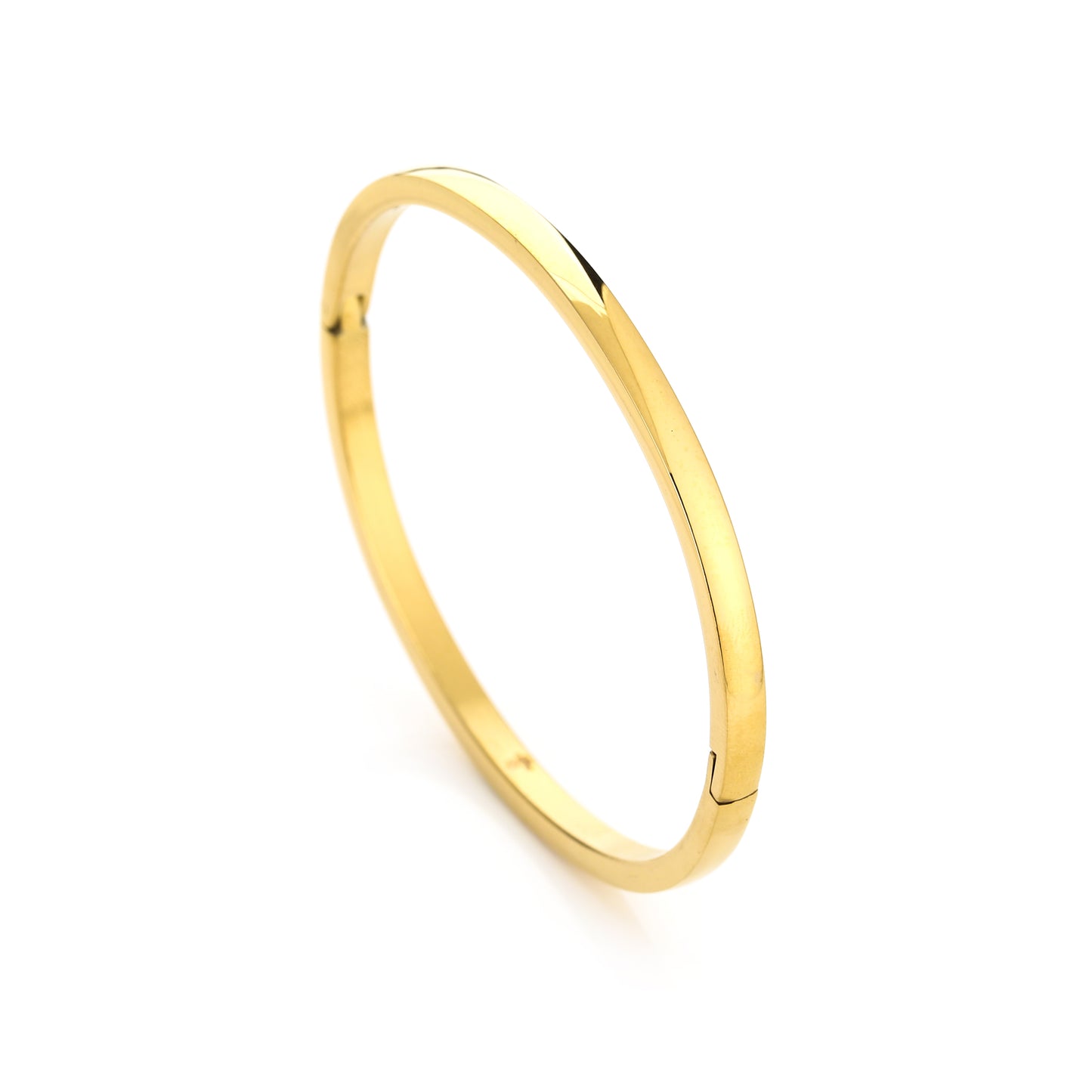 Elegant minimalist gold bangle bracelet on a white background, showcasing a sleek and timeless design suitable for fashion and jewelry styling.