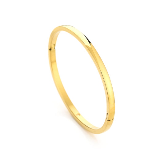 Elegant minimalist gold bangle bracelet on a white background, showcasing a sleek and timeless design suitable for fashion and jewelry styling.